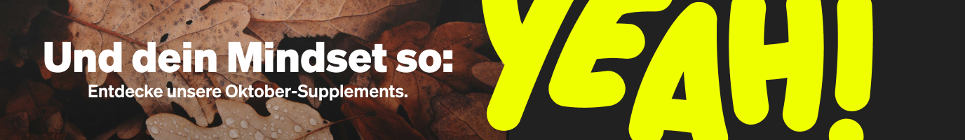 Text in Deutsch über Herbstlaub-Hintergrund lautet: "Und dein Mindset so: Entdecke unsere Oktober-Supplements YEAH!" in fetten weißen und gelben Buchstaben.
